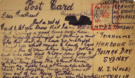 A scan of an old, yellowed postcard with cursive writing on it, addressed to someone living in Mosman Bay, Sydney.